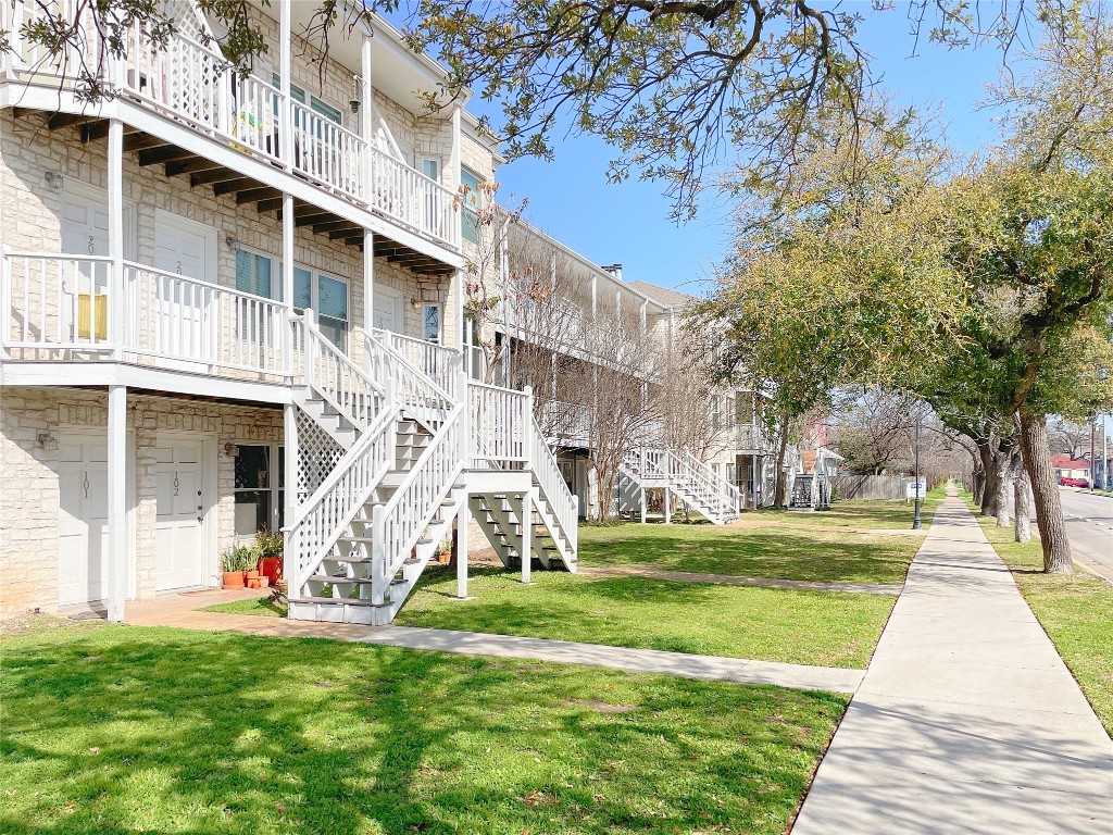 3400 Speedway, Unit 105 Austin, TX 78705 - Photo 2 of 18 a view of a white house with a big yard and large trees