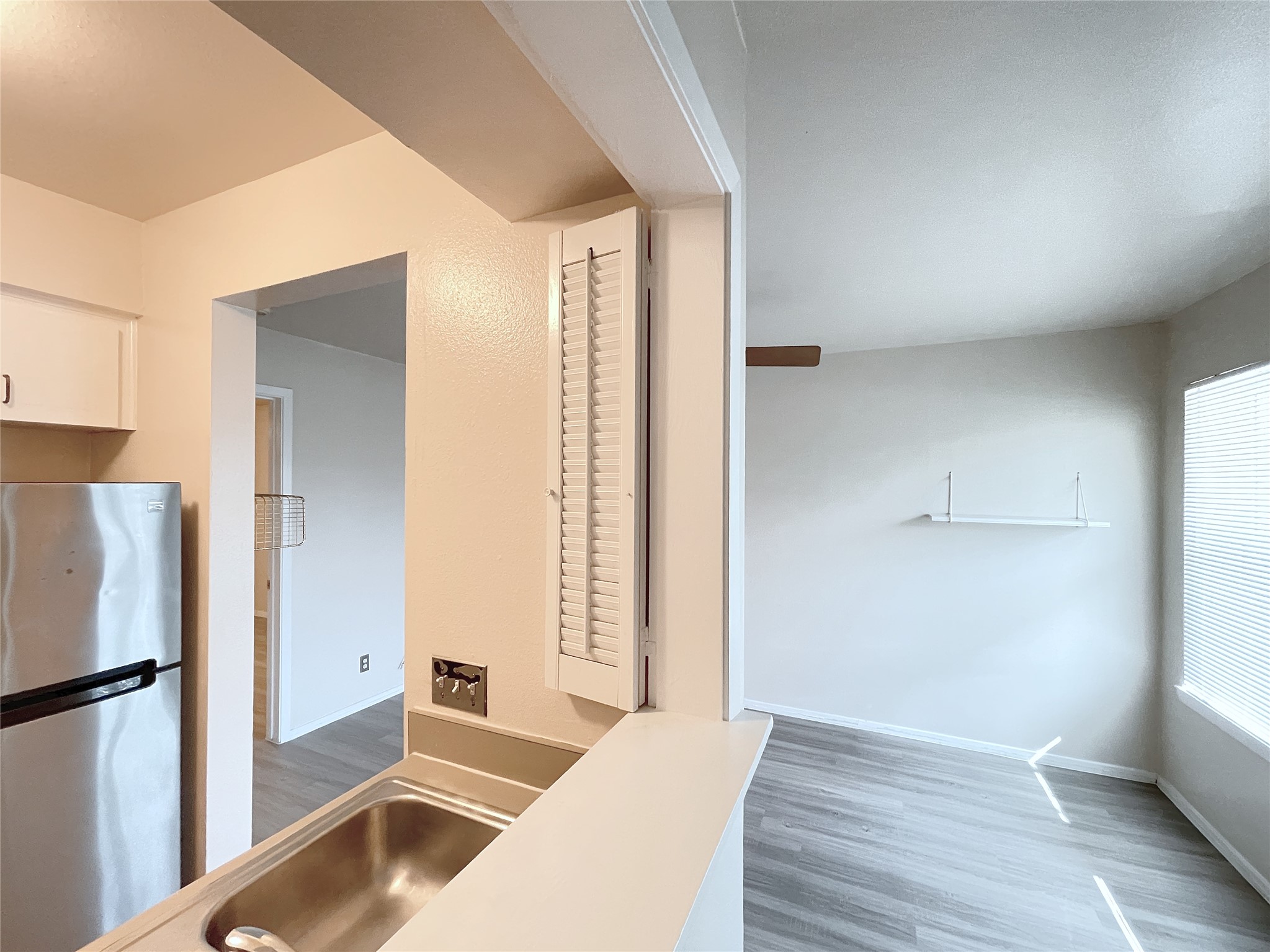 3400 Speedway, Unit 105 Austin, TX 78705 - Photo 5 of 18 a living room with a bed and a refrigerator