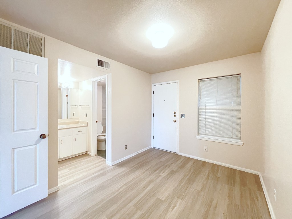 3400 Speedway, Unit 105 Austin, TX 78705 - Photo 9 of 18 wooden floor in an empty room