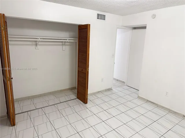 an empty room with white door