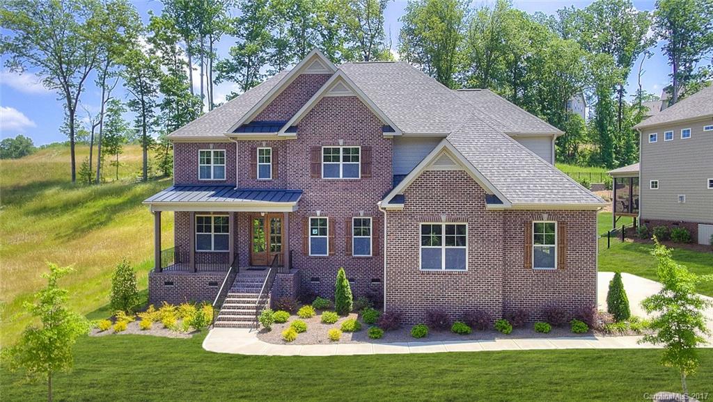 160 Forsythia Lane, Unit 739 Tega Cay, SC 29708 - Photo 1 of 24 a front view of a house with a yard