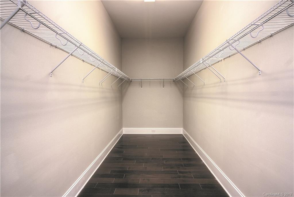160 Forsythia Lane, Unit 739 Tega Cay, SC 29708 - Photo 12 of 24 a view of a hallway with wooden floor