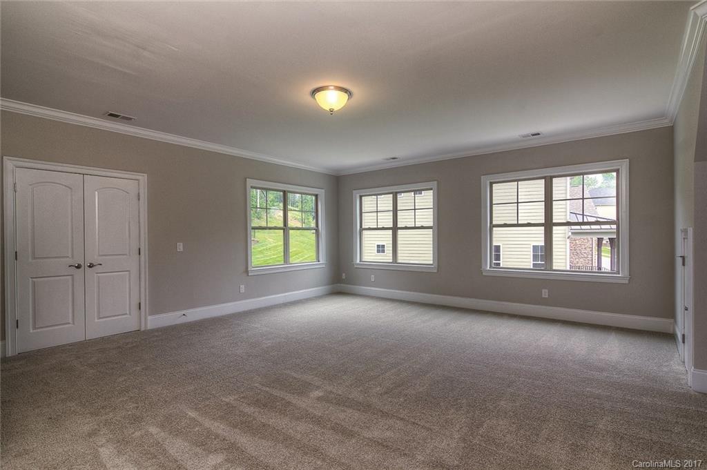 160 Forsythia Lane, Unit 739 Tega Cay, SC 29708 - Photo 13 of 24 a view of an empty room with a window