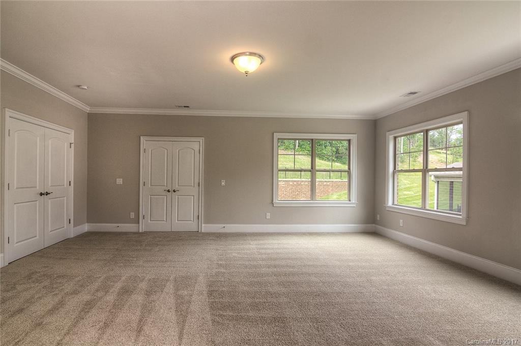 160 Forsythia Lane, Unit 739 Tega Cay, SC 29708 - Photo 14 of 24 a view of an empty room with a window