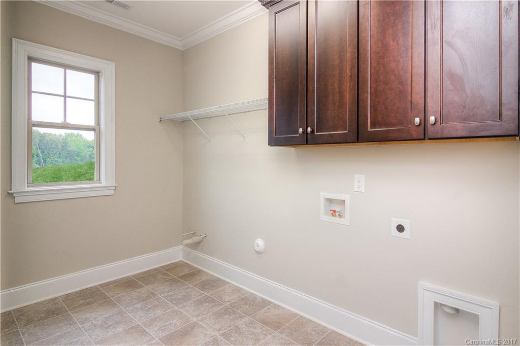 160 Forsythia Lane, Unit 739 Tega Cay, SC 29708 - Photo 17 of 24 a view of a small space with wooden floor and a window