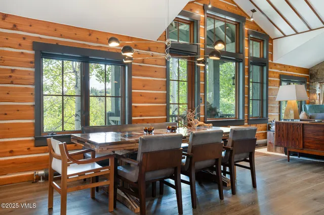 a view of a dining room with furniture window and outside view