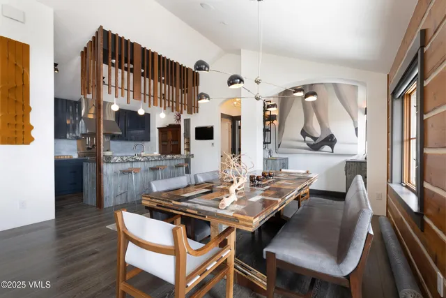 a view of a dining room with furniture and a flat screen tv