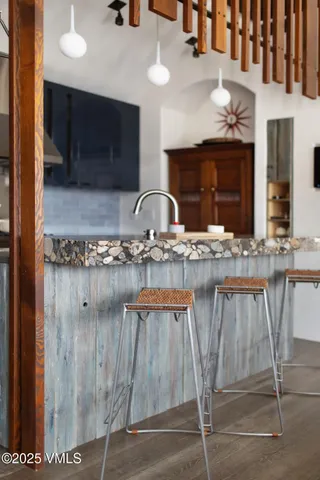 a kitchen with stainless steel appliances kitchen island granite countertop a granite counter tops and wooden cabinets