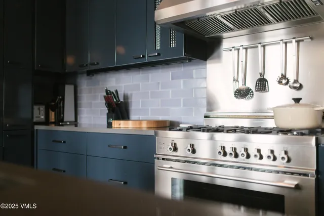 a kitchen with a stove and a microwave