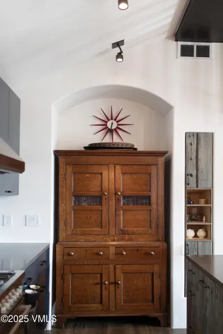 a bedroom with a bed chairs and window