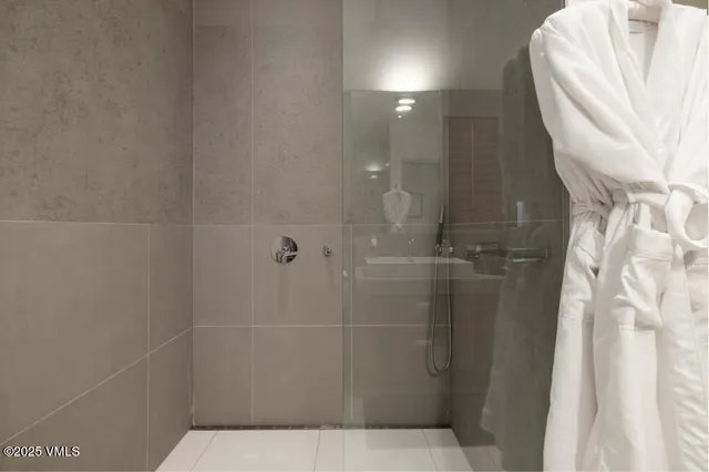 a living room with furniture and a dining table