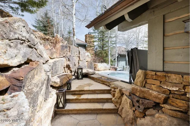 a view of backyard with outdoor seating and trees