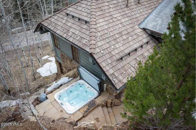 a front view of a building with table and chairs