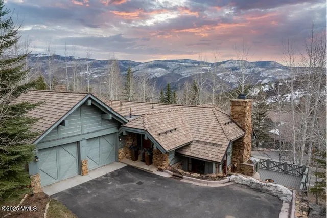 an aerial view of a house with a yard and garage
