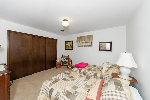 a bed room with a bed and a table