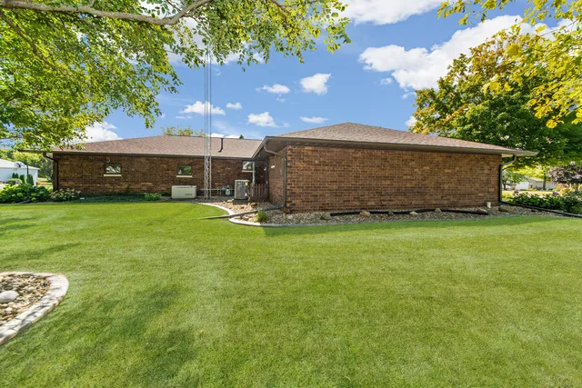 a view of a back yard with a wooden fence