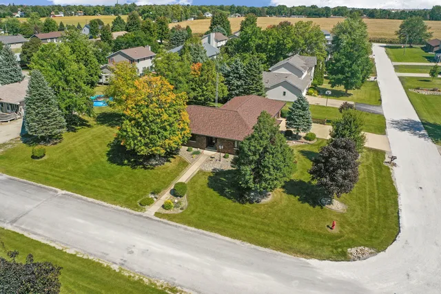 an aerial view of a house having yard