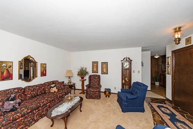 a living room with furniture piano and a flat screen tv