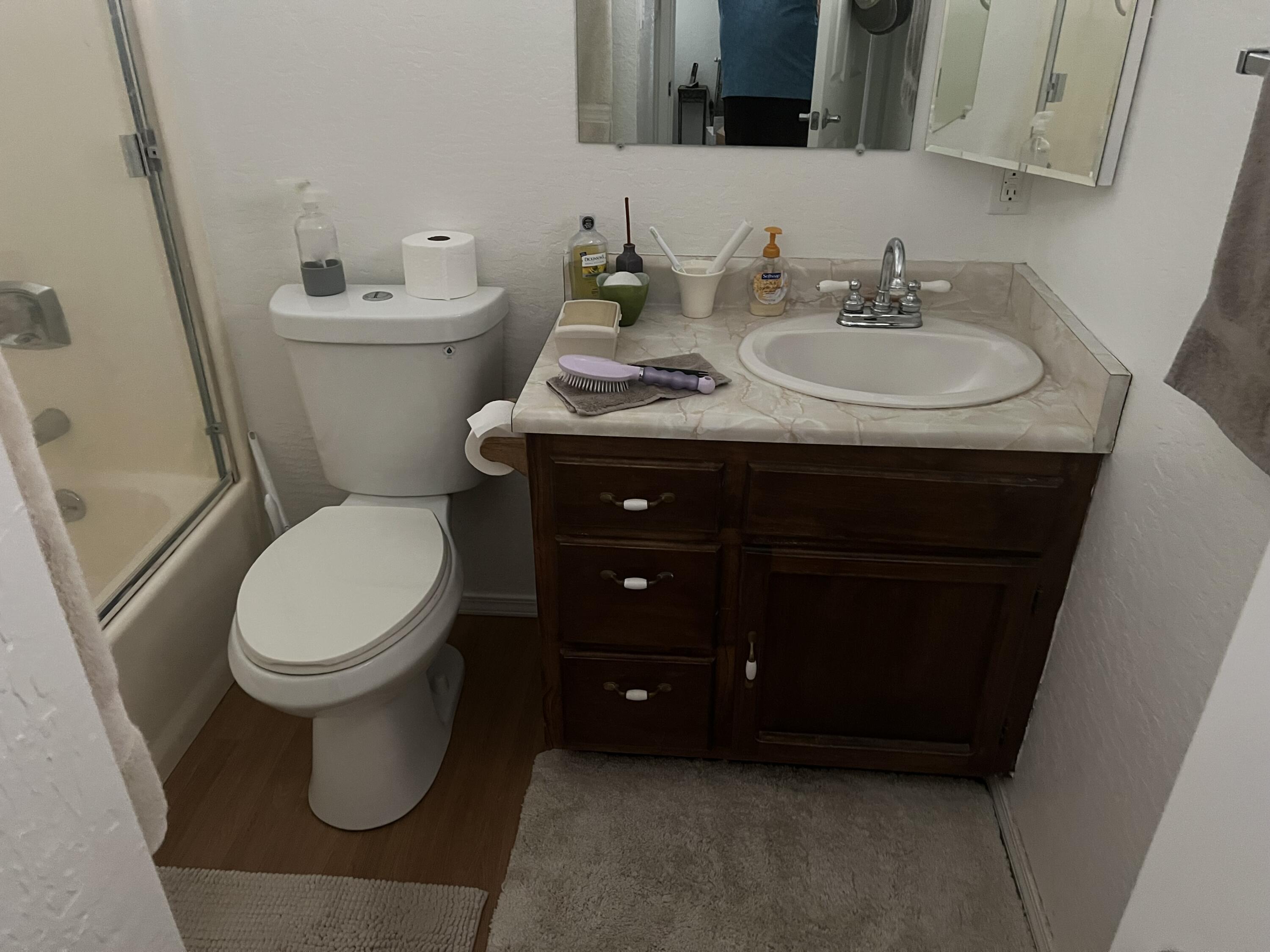 4945 Rim Wood Road Pine, AZ 85544 - Photo 12 of 26 a bathroom with a toilet sink and mirror