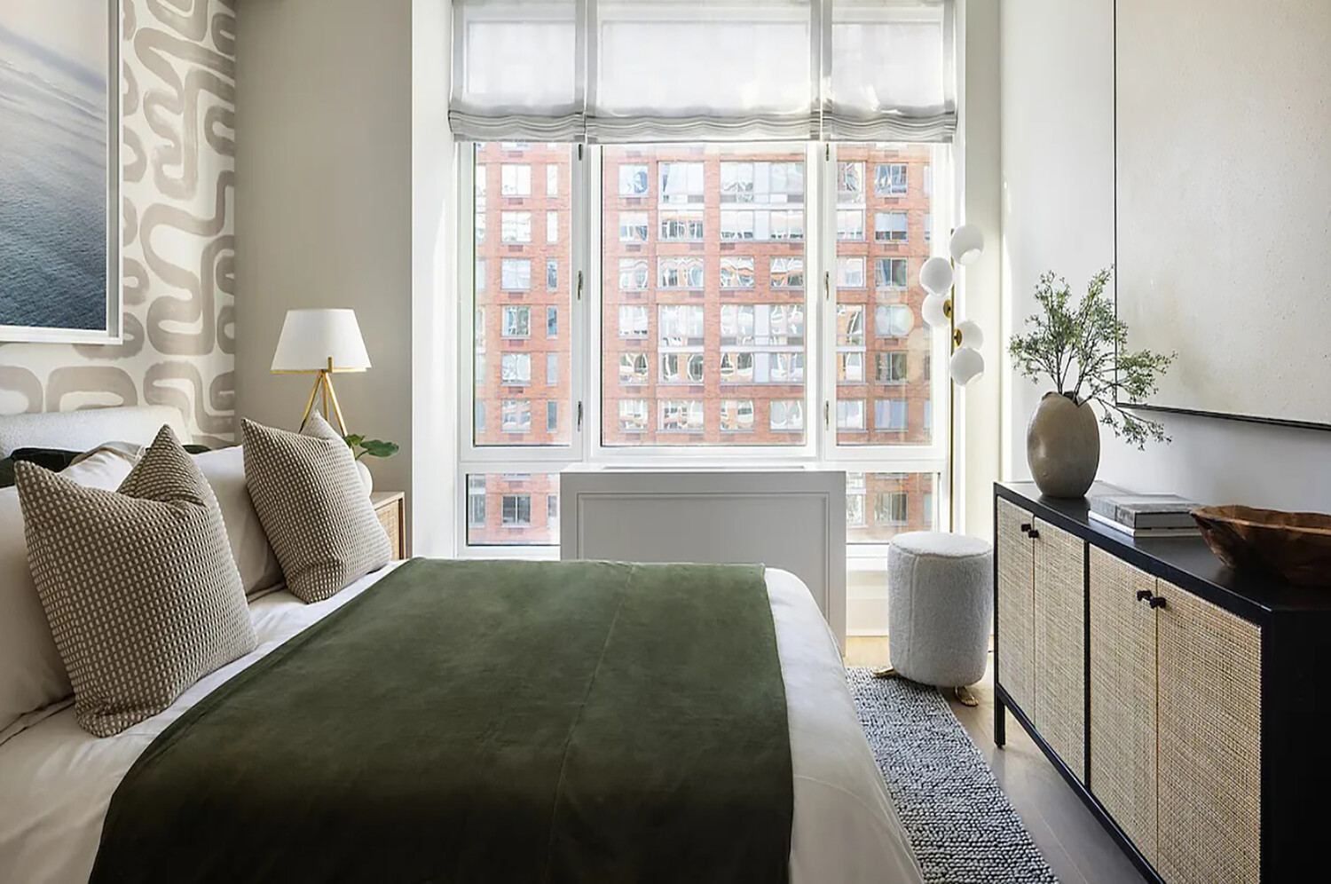 210 Warren Street, Unit 9G Manhattan, NY 10282 - Photo 4 of 11 a bedroom with a bed and a large window