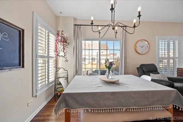 a bedroom with a bed a window and dresser