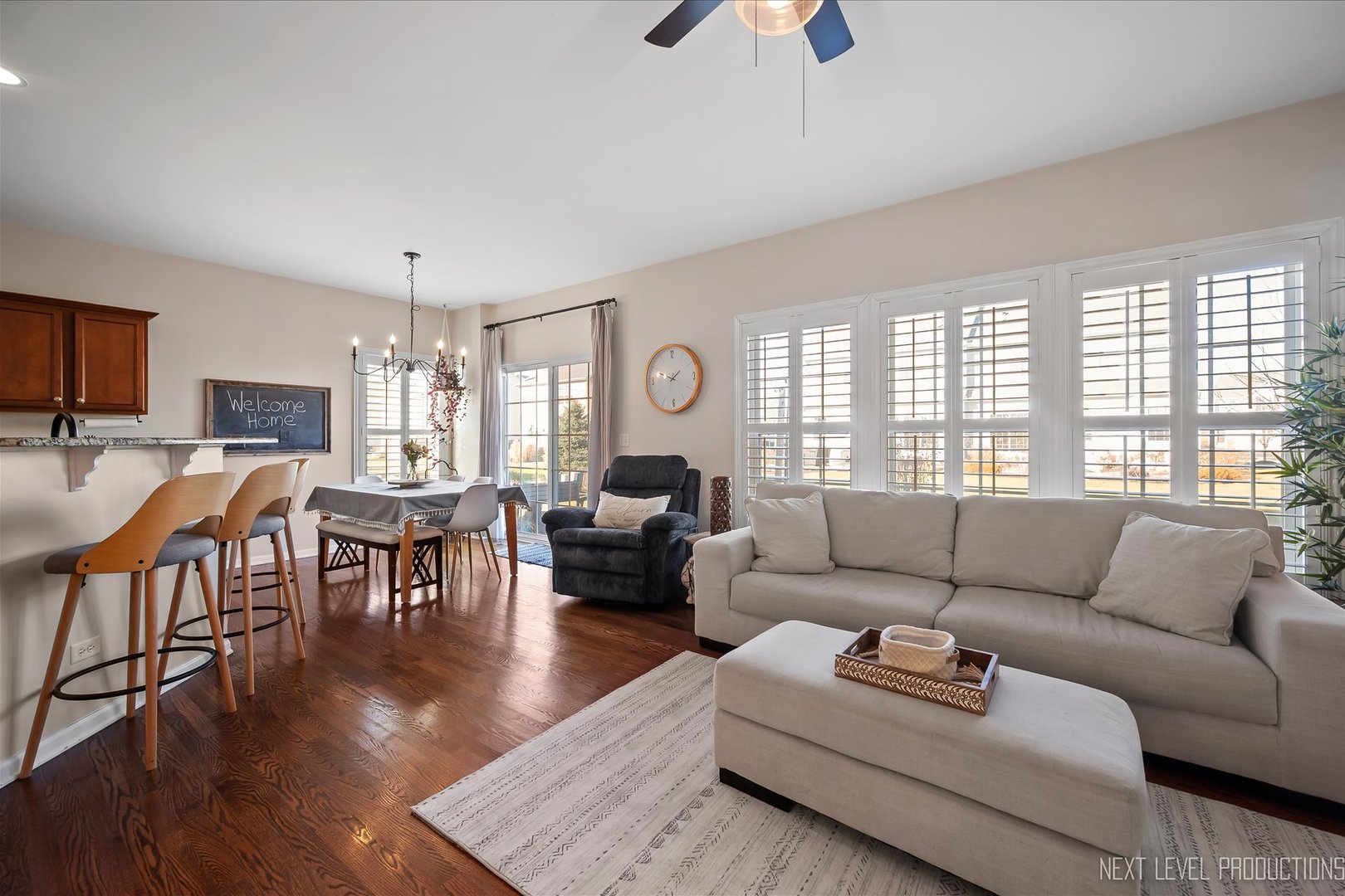 1164 Freedom Road Elburn, IL 60119 - Photo 14 of 31 a living room with furniture wooden floor and a large window