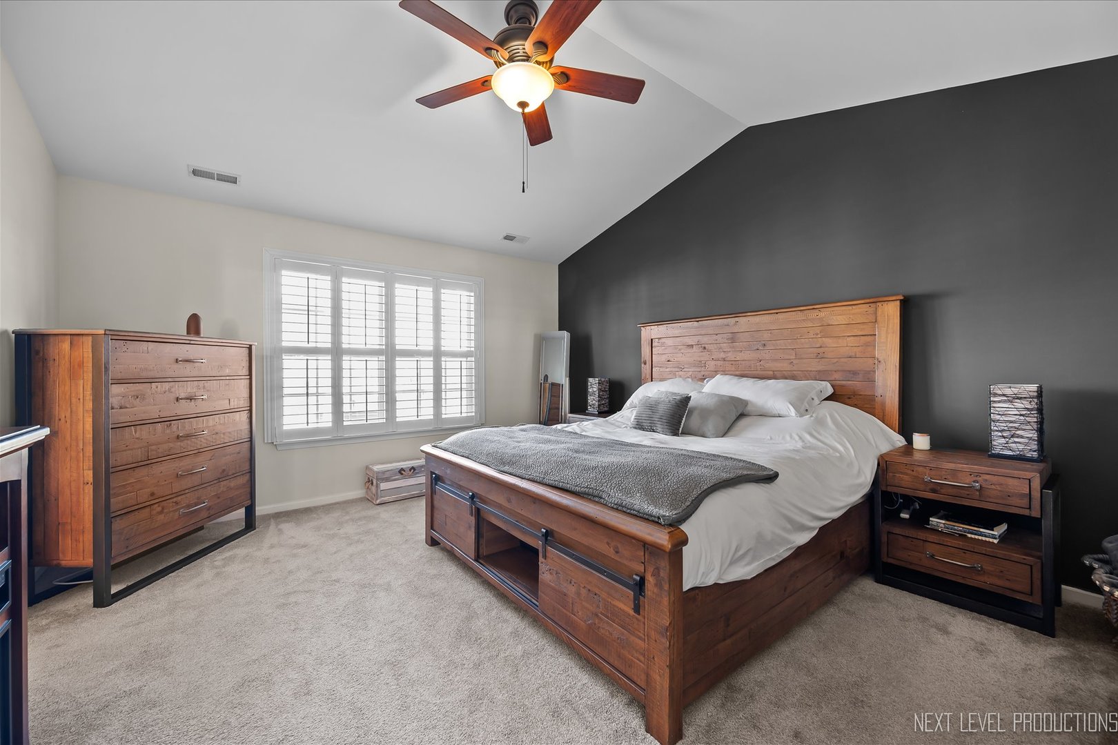 1164 Freedom Road Elburn, IL 60119 - Photo 17 of 31 a spacious bedroom with a bed and a chandelier