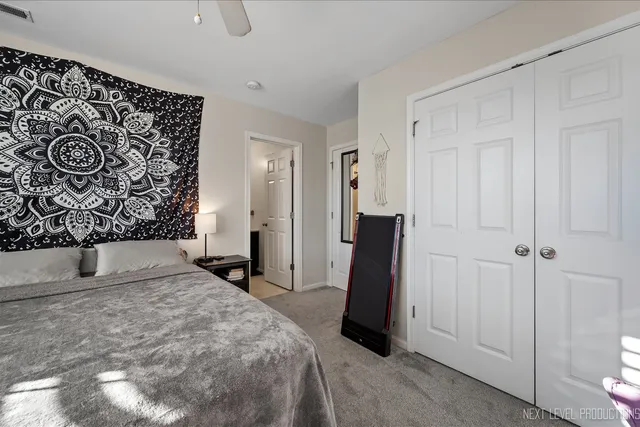 a bedroom with a bed and a door