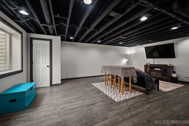 a view of a livingroom with furniture and a flat screen tv