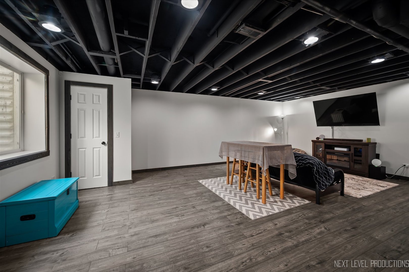 1164 Freedom Road Elburn, IL 60119 - Photo 25 of 31 a view of a livingroom with furniture and a flat screen tv