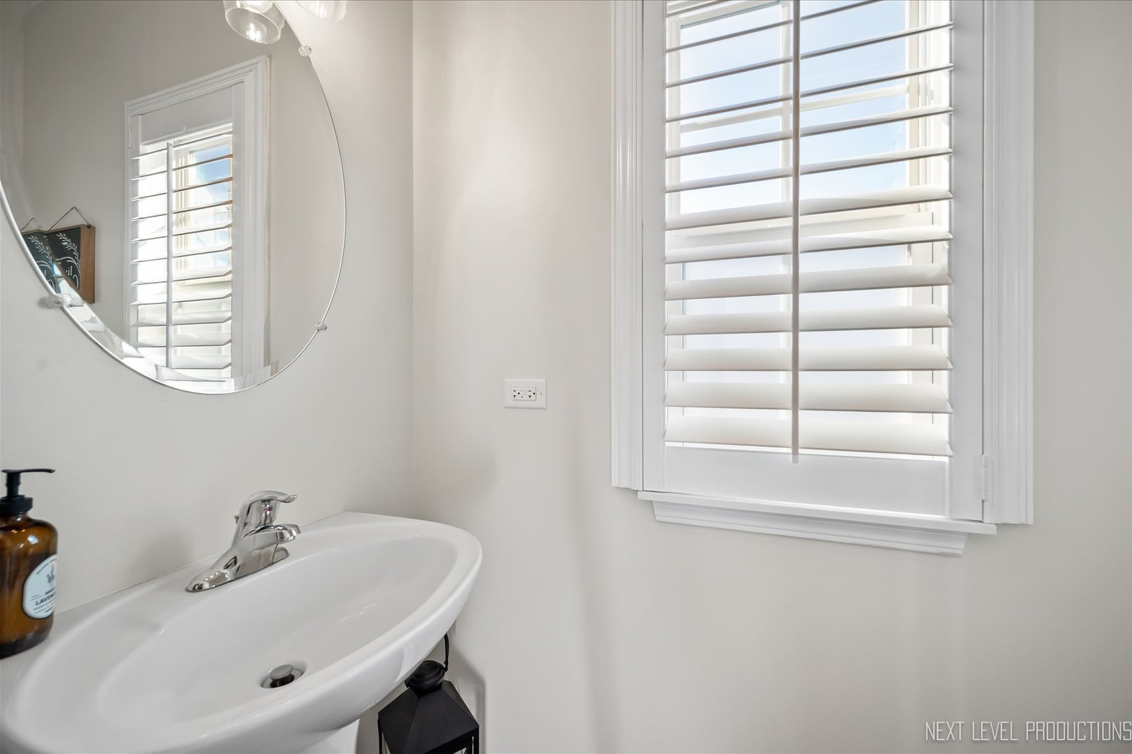 1164 Freedom Road Elburn, IL 60119 - Photo 3 of 31 a bathroom with a sink and a window