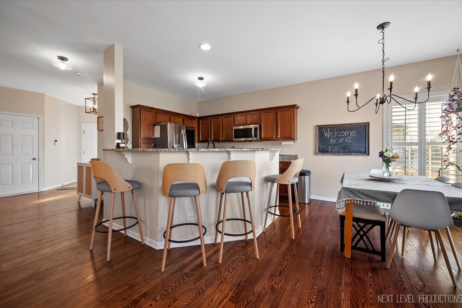 1164 Freedom Road Elburn, IL 60119 - Photo 10 of 31 a view of a dining room with furniture and wooden floor