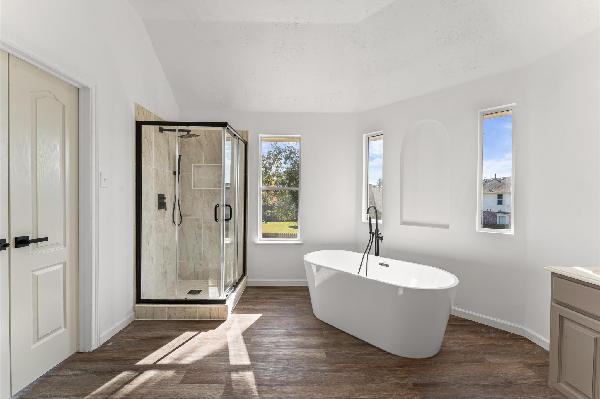 a bathroom with a bathtub and shower