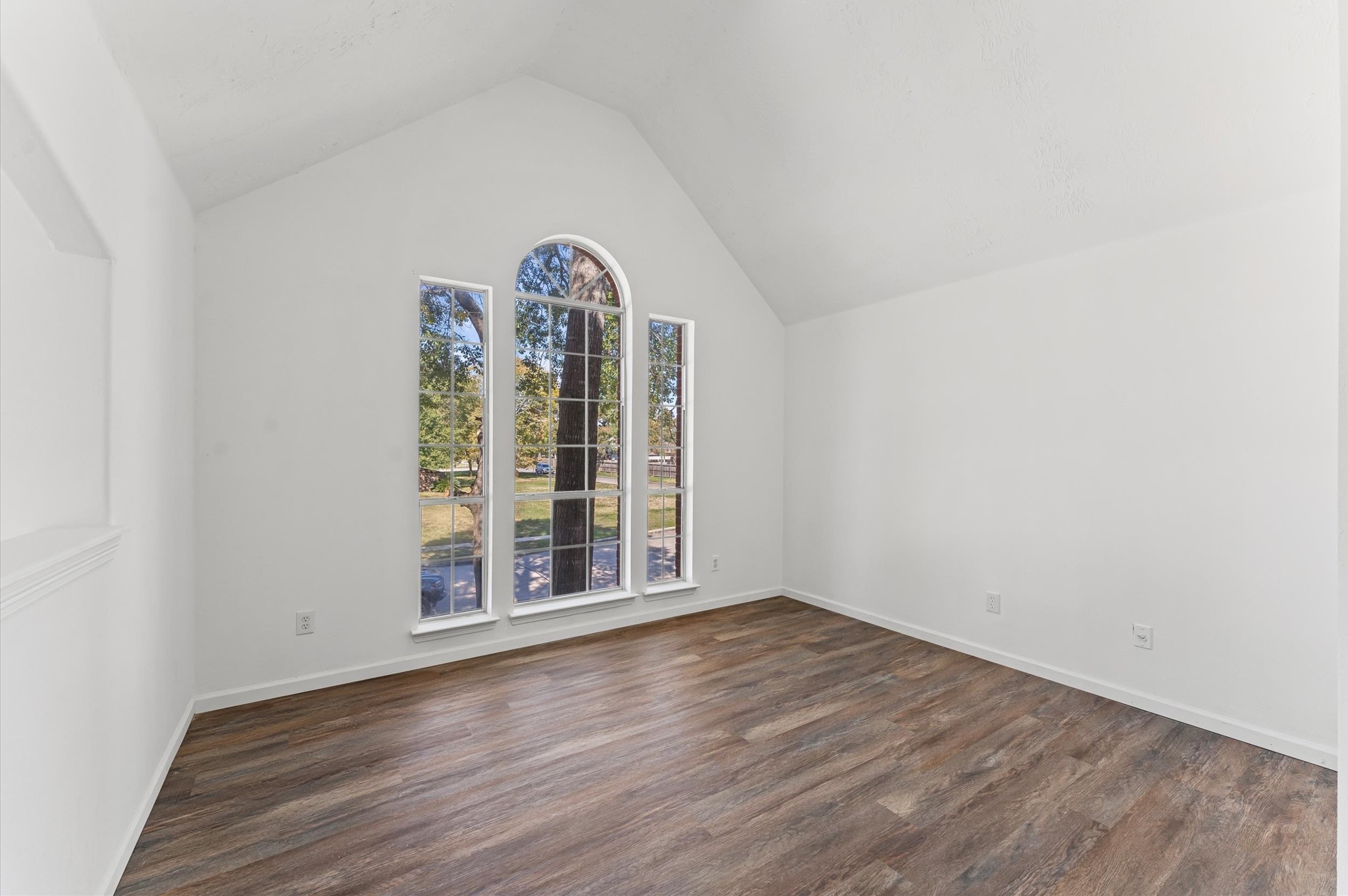 2830 Fern Hill Drive Spring, TX 77373 - Photo 11 of 22 an empty room with wooden floor and windows