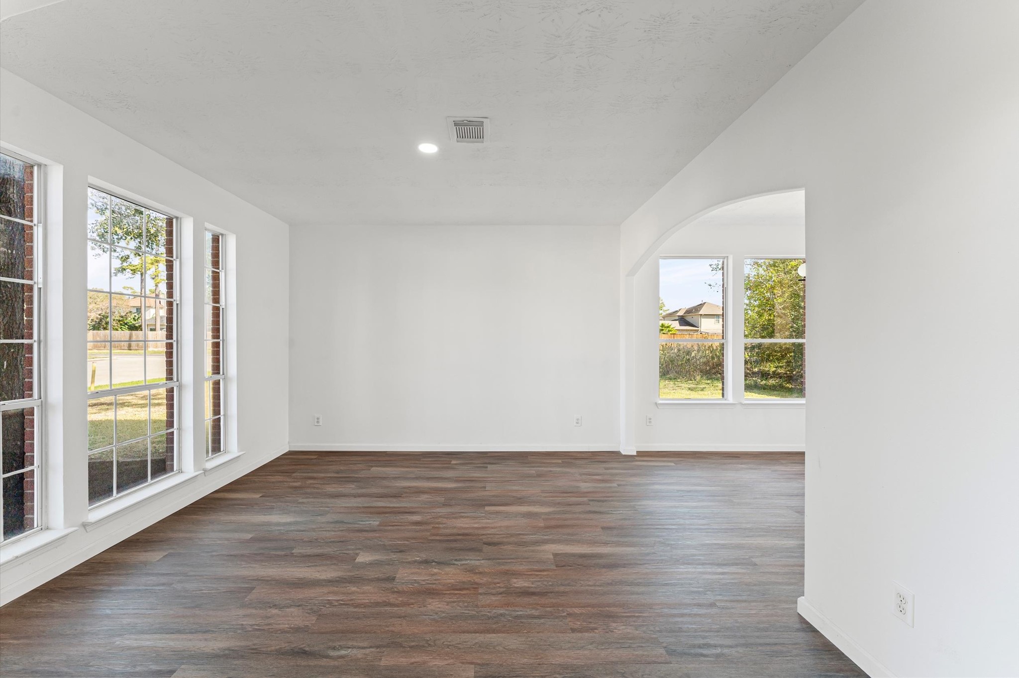 2830 Fern Hill Drive Spring, TX 77373 - Photo 2 of 22 a view of an empty room with wooden floor and a window