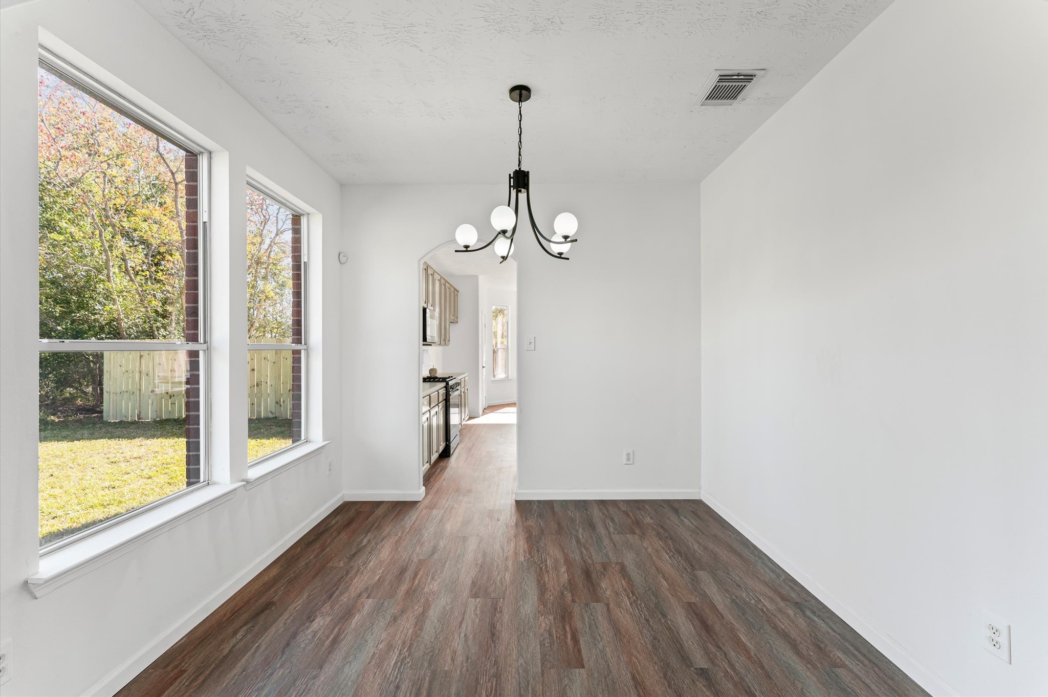 2830 Fern Hill Drive Spring, TX 77373 - Photo 3 of 22 a view of a room with wooden floor fan and windows