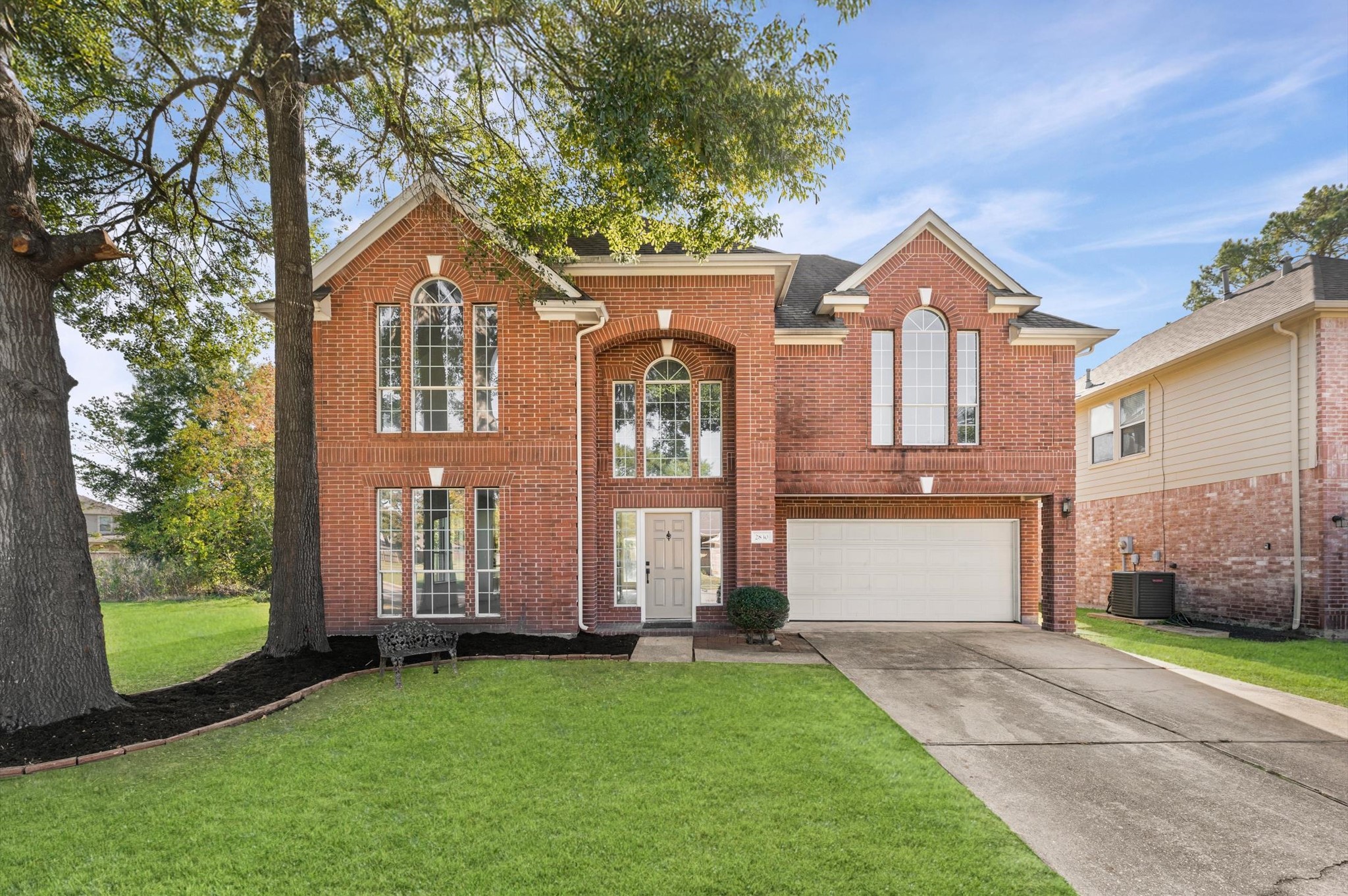 2830 Fern Hill Drive Spring, TX 77373 - Photo 5 of 22 a front view of a house with a garden