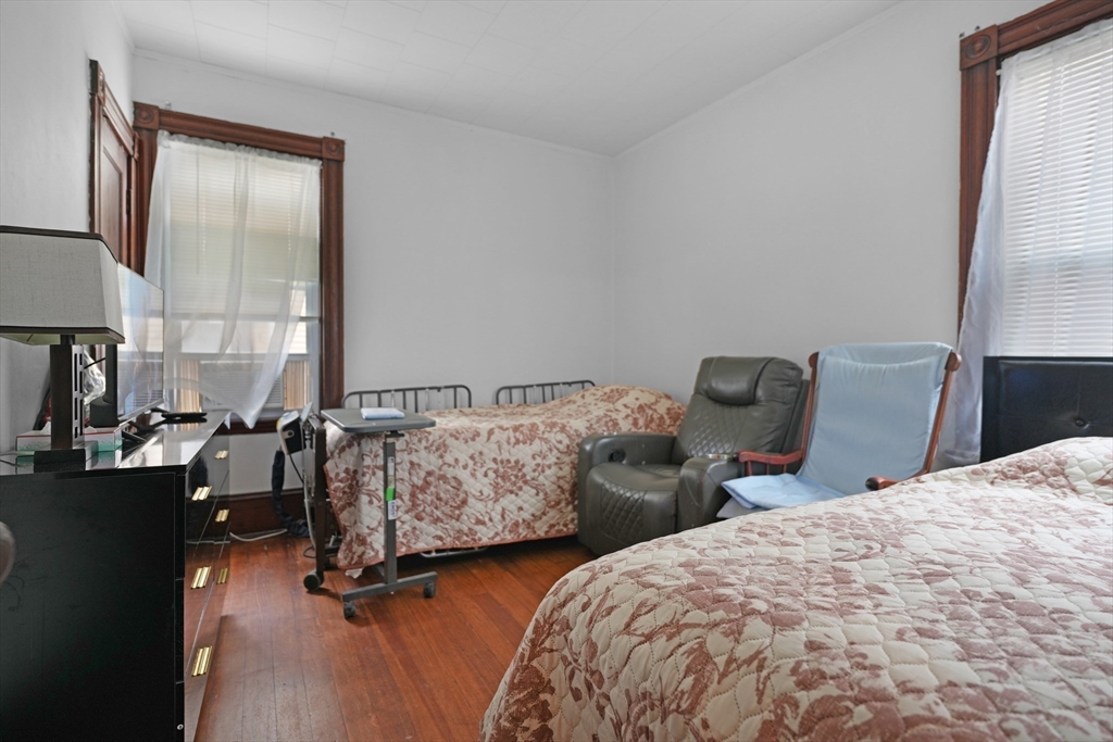 135-137 Query Street New Bedford, MA 02745 - Photo 12 of 17 a bedroom with two beds and a dresser