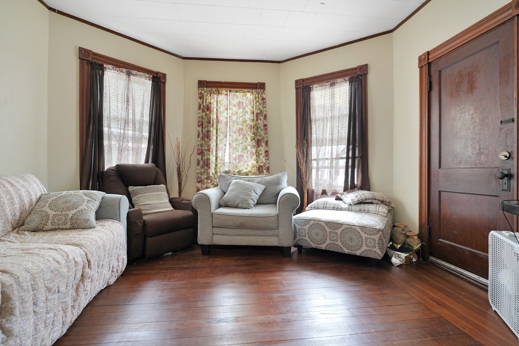 135-137 Query Street New Bedford, MA 02745 - Photo 7 of 17 a bedroom with two beds and a couch