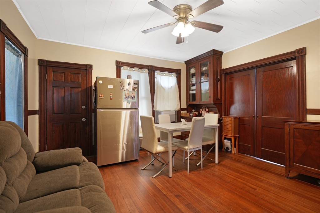 135-137 Query Street New Bedford, MA 02745 - Photo 9 of 17 a view of a dining room with furniture window and wooden floor