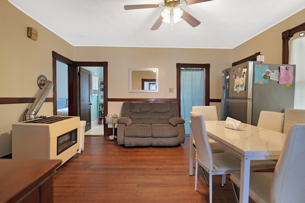 135-137 Query Street New Bedford, MA 02745 - Photo 10 of 17 a living room with furniture and a fireplace