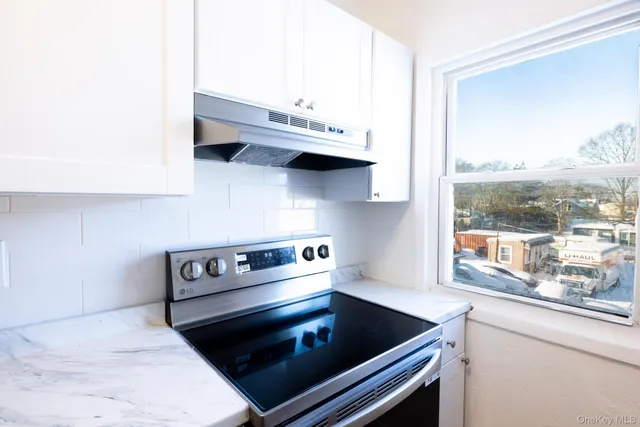 a kitchen with a stove and a microwave