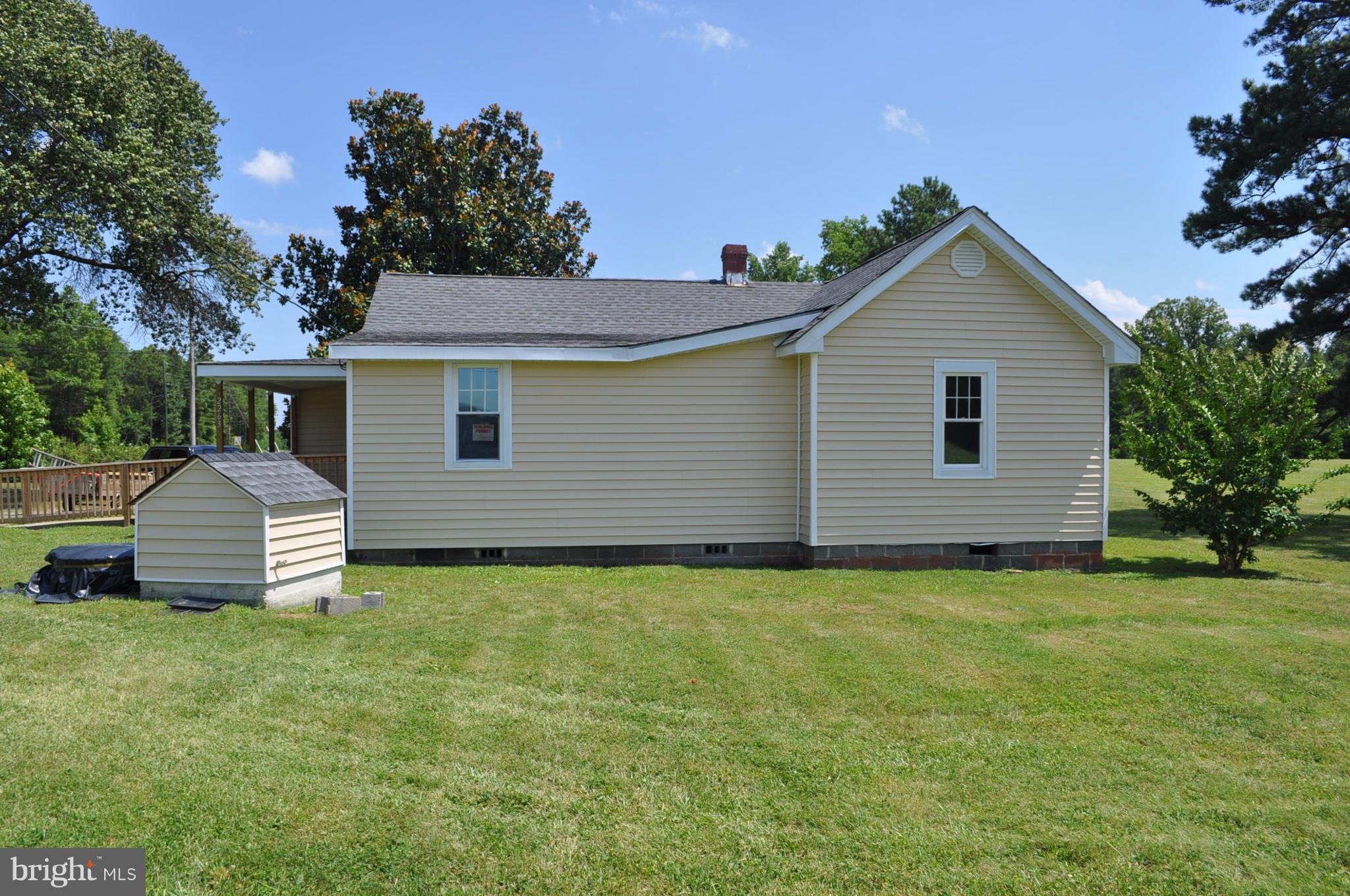 2263 Pomona Road Colonial Beach, VA 22443 - Photo 24 of 28 a front view of a house with a yard