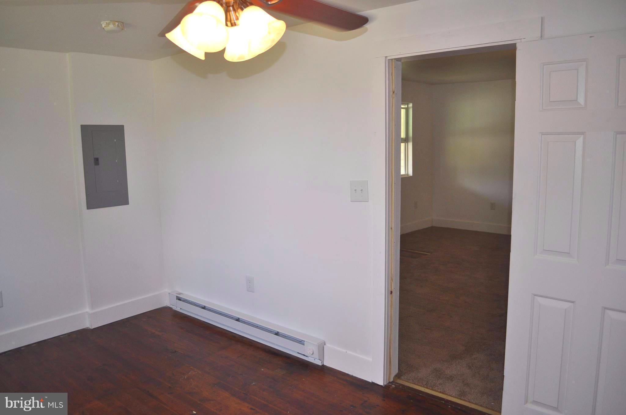 2263 Pomona Road Colonial Beach, VA 22443 - Photo 8 of 28 an empty room with wooden floor