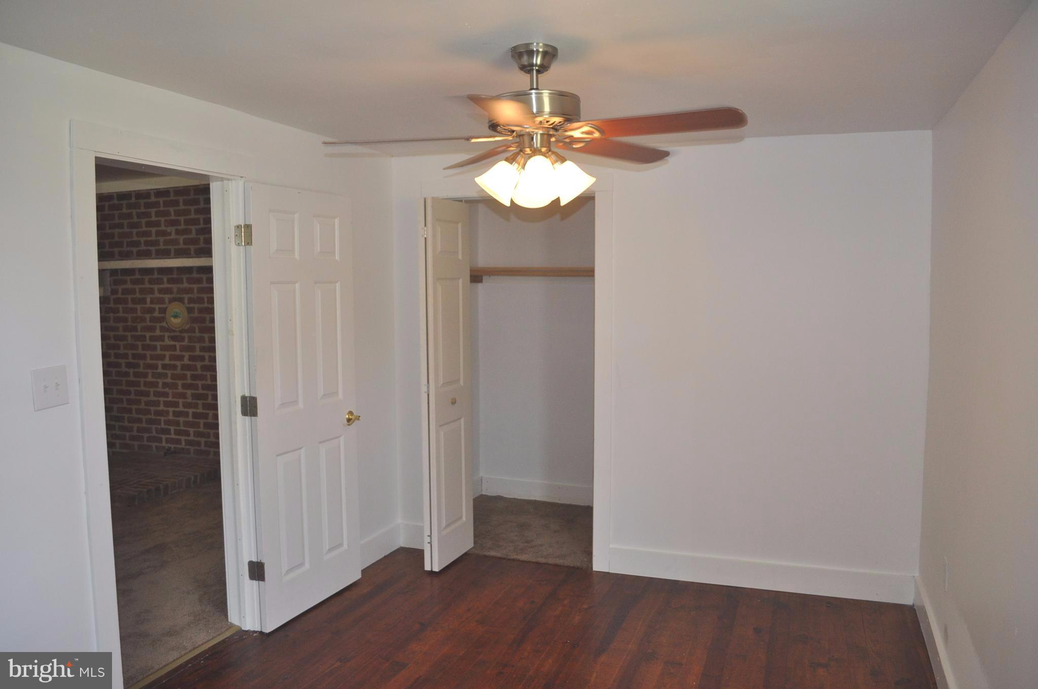 2263 Pomona Road Colonial Beach, VA 22443 - Photo 9 of 28 a view of an empty room with wooden floor