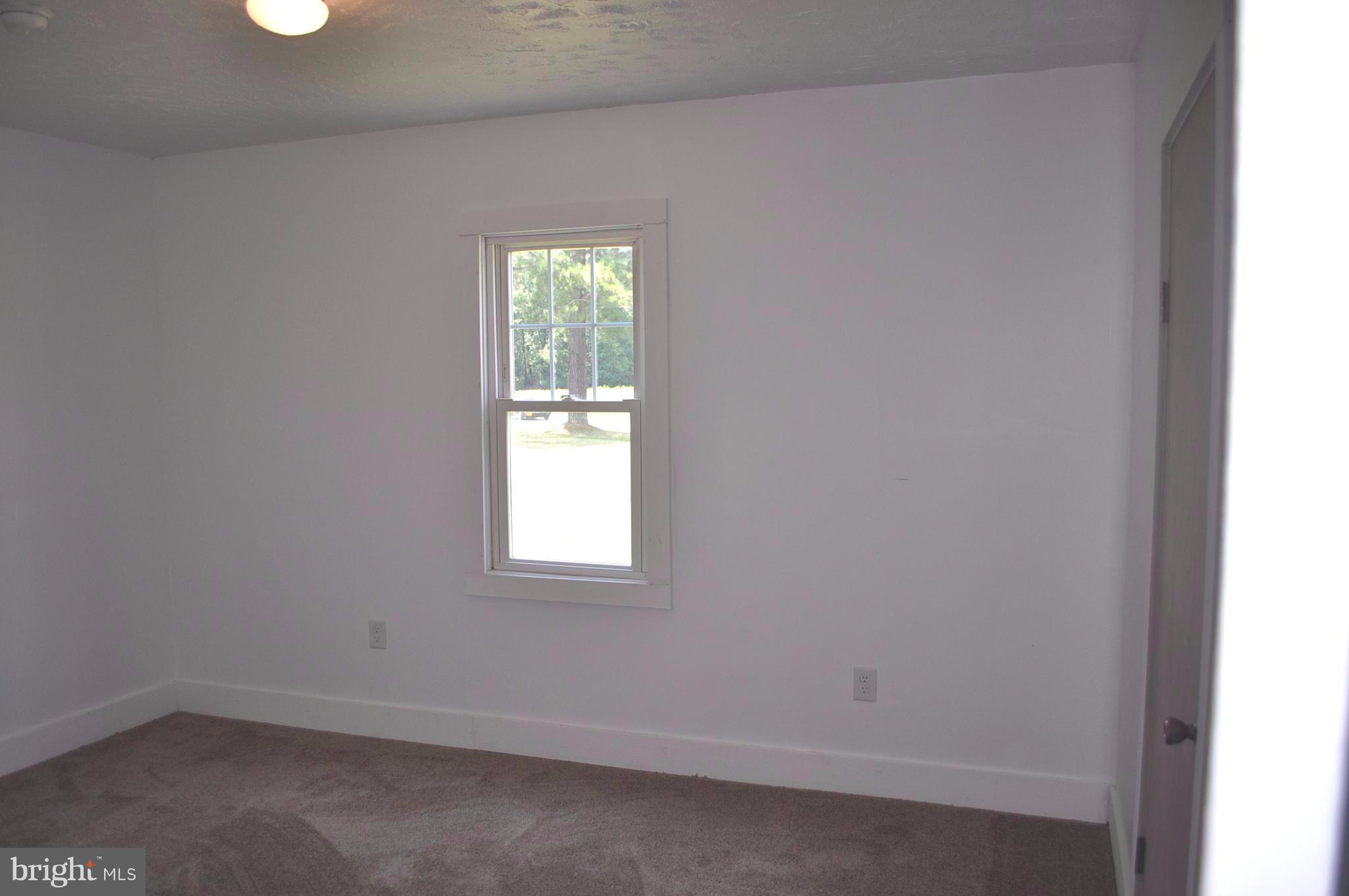 2263 Pomona Road Colonial Beach, VA 22443 - Photo 10 of 28 an empty room with a window