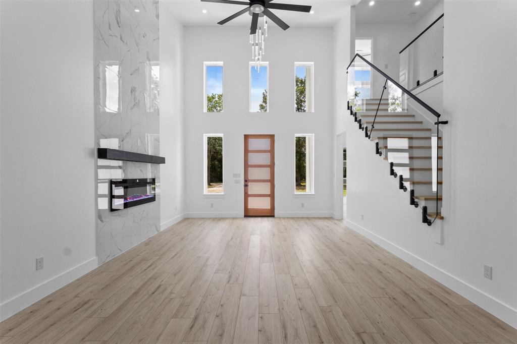 180 County Road 2245 Emory, TX 75440 - Photo 2 of 34 wooden floor in an empty room with a window