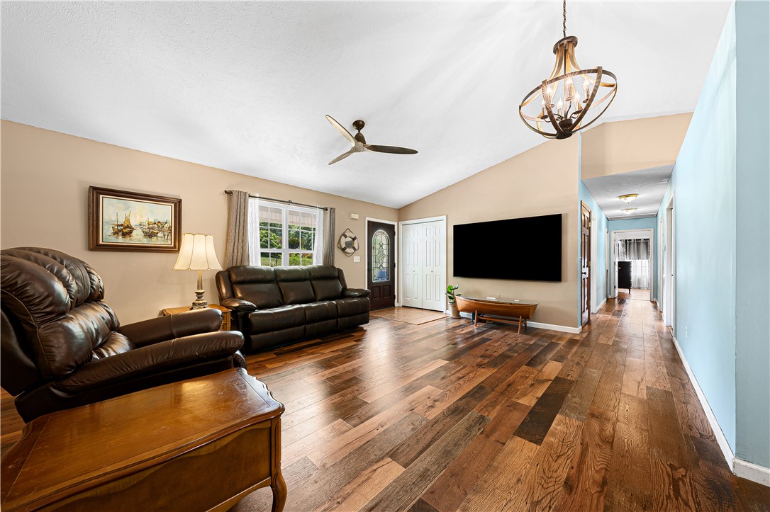 281 Cherokee Drive Fair Play, SC 29643 - Photo 7 of 26 Natural light illuminates the rich hardwood floors and high vaulted ceilings of this inviting living area.