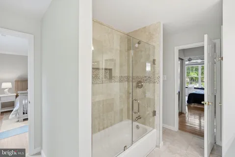 a bedroom with bed and a window