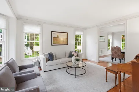 a living room with furniture and windows